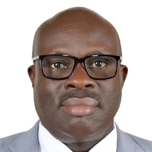 Head and shoulders photo of Sam Mugume.