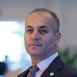Head and shoulders photo of Mehrali Ecer.
