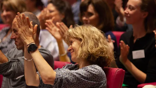 Audience clapping at IIED event